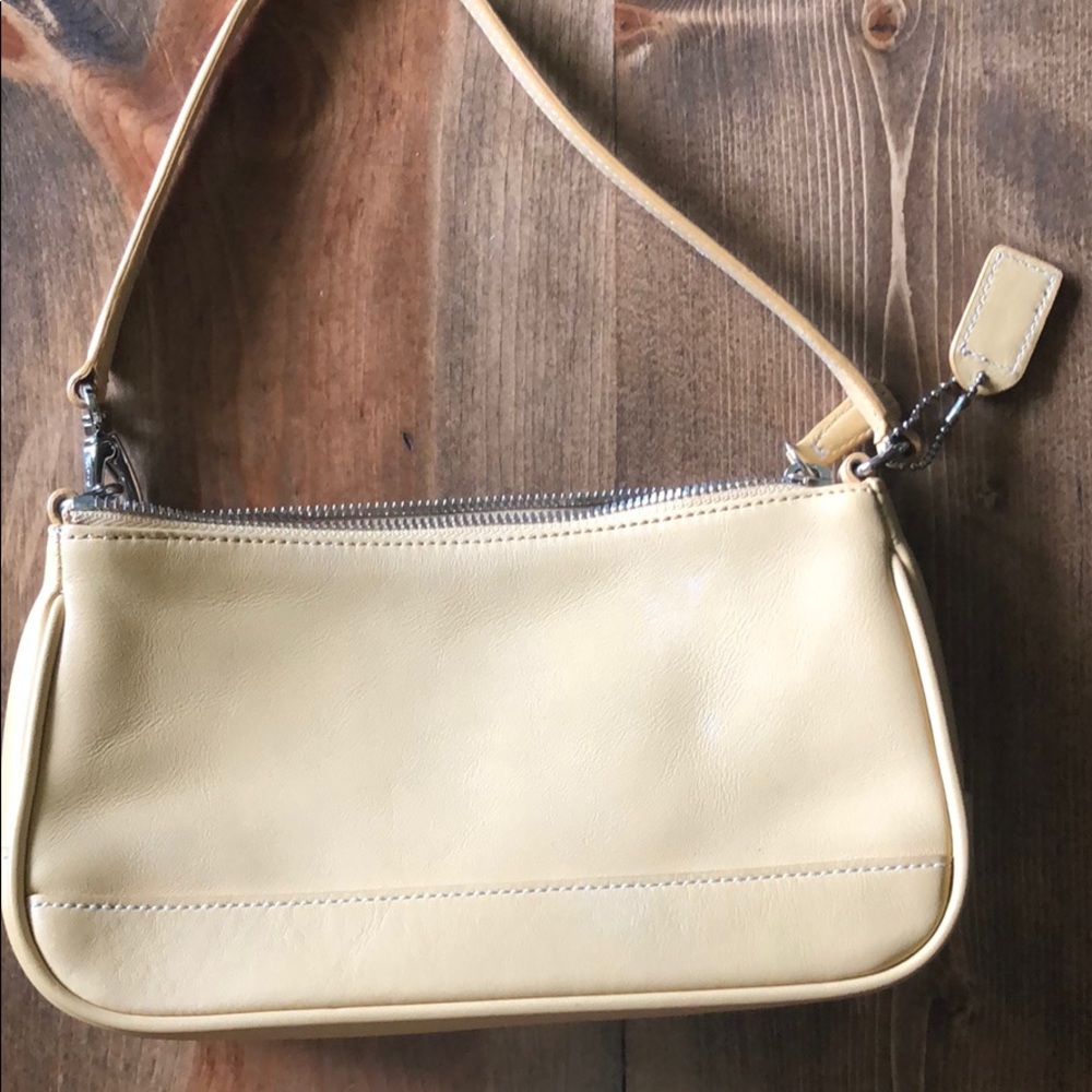 Yellow/beige Coach purse